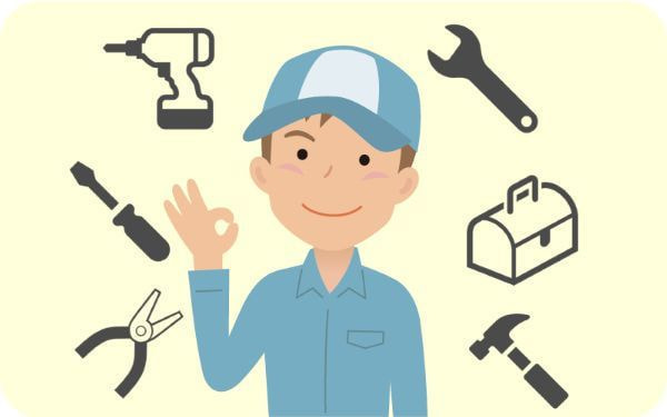 電動ドライバーや工具を背景にした作業服の男性のイラスト